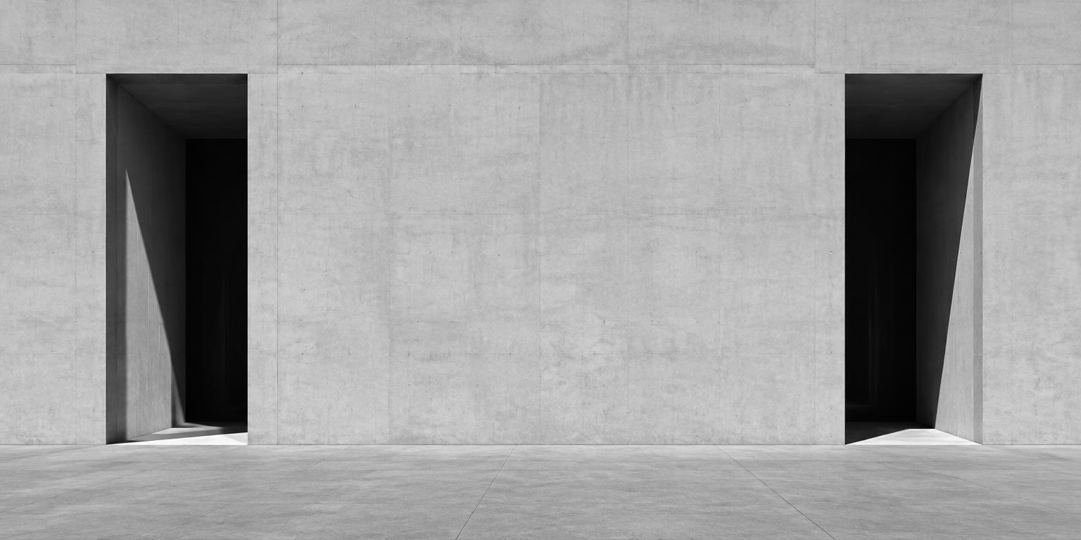 Two separate entrances in a concrete wall